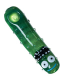 Top view of Empire Glassworks Pickle Rick Spoon Pipe, which is a green pipe with glass bumps to represent a pickle. There is also a Rick face on the mouthpiece end of pipe. The pipe is displayed on a white background.